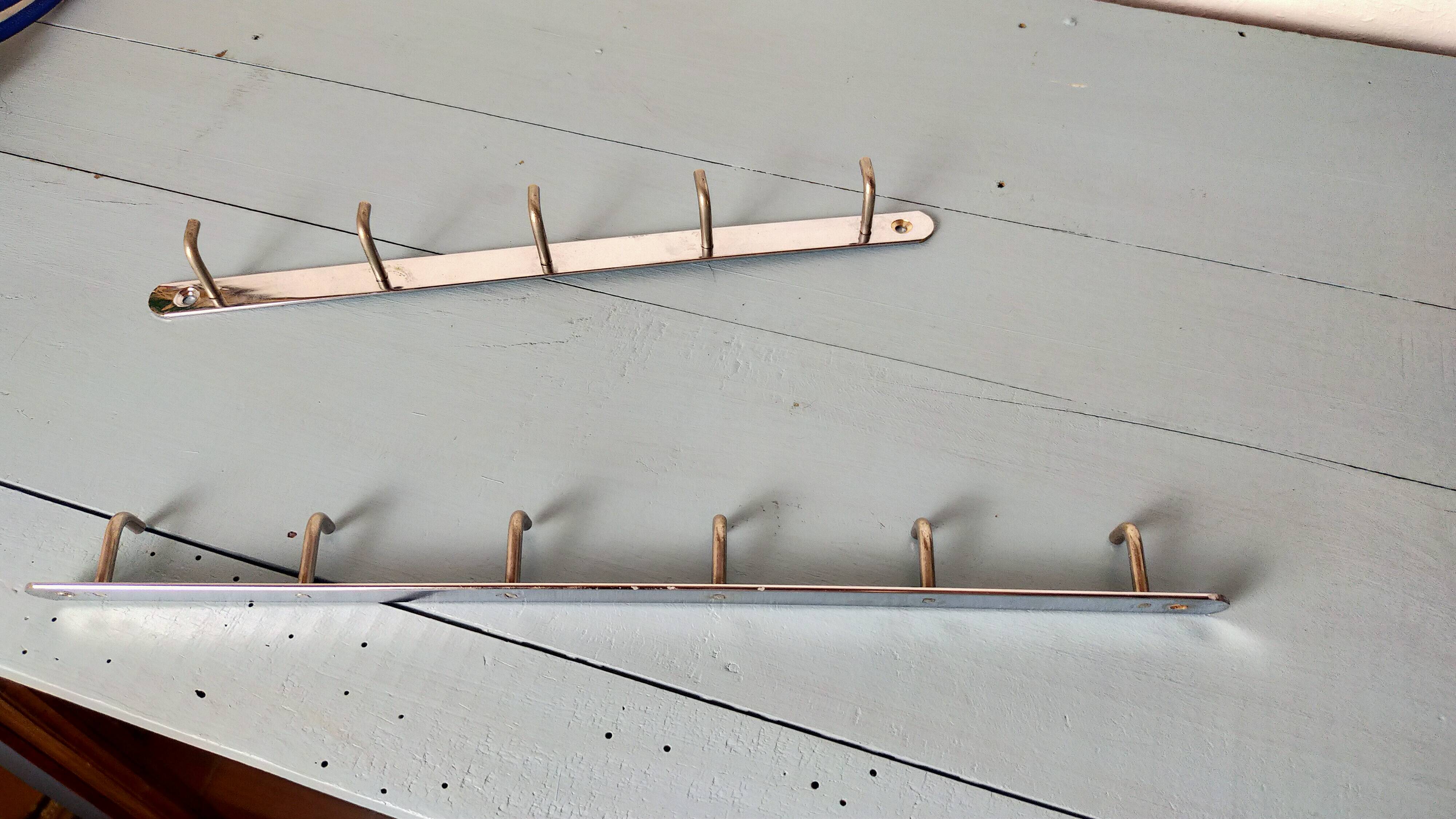 Two chrome tea towel hooks