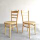 Paire chaises Baumann bois clair et cannage