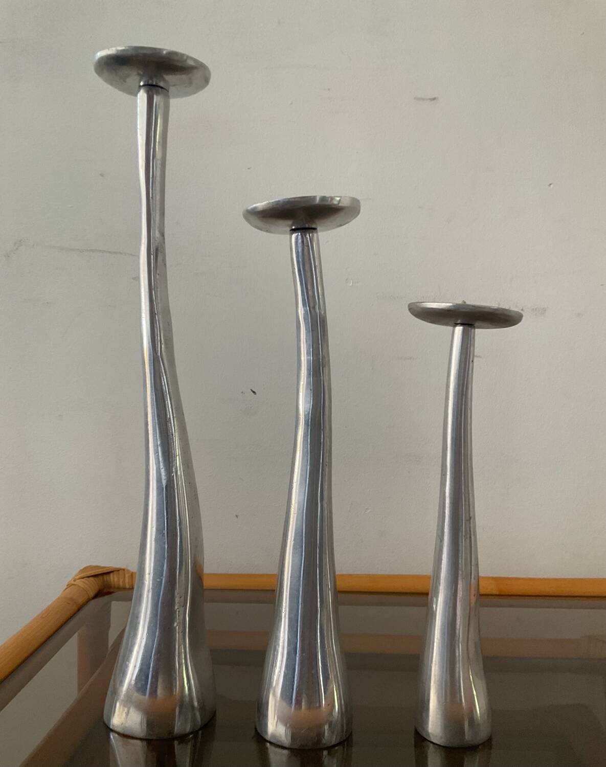 Trio of vintage cast aluminum candlesticks