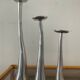 Trio of vintage cast aluminum candlesticks