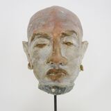 Face sculpture in polychrome earth and plaster, cabinet of curiosities. Ph Monaux. Ariège artist