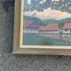 Large naive oil painting signed Medrano: rice field and buffalo, village with roofs of