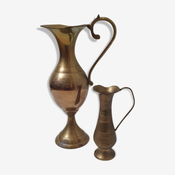 Set of two brass pitchers