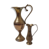 Set of two brass pitchers
