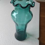 Blown glass vase with a flared neck and wavy rim.