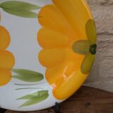Round serving dish with hand-painted yellow flowers in ceramic TC Italy.