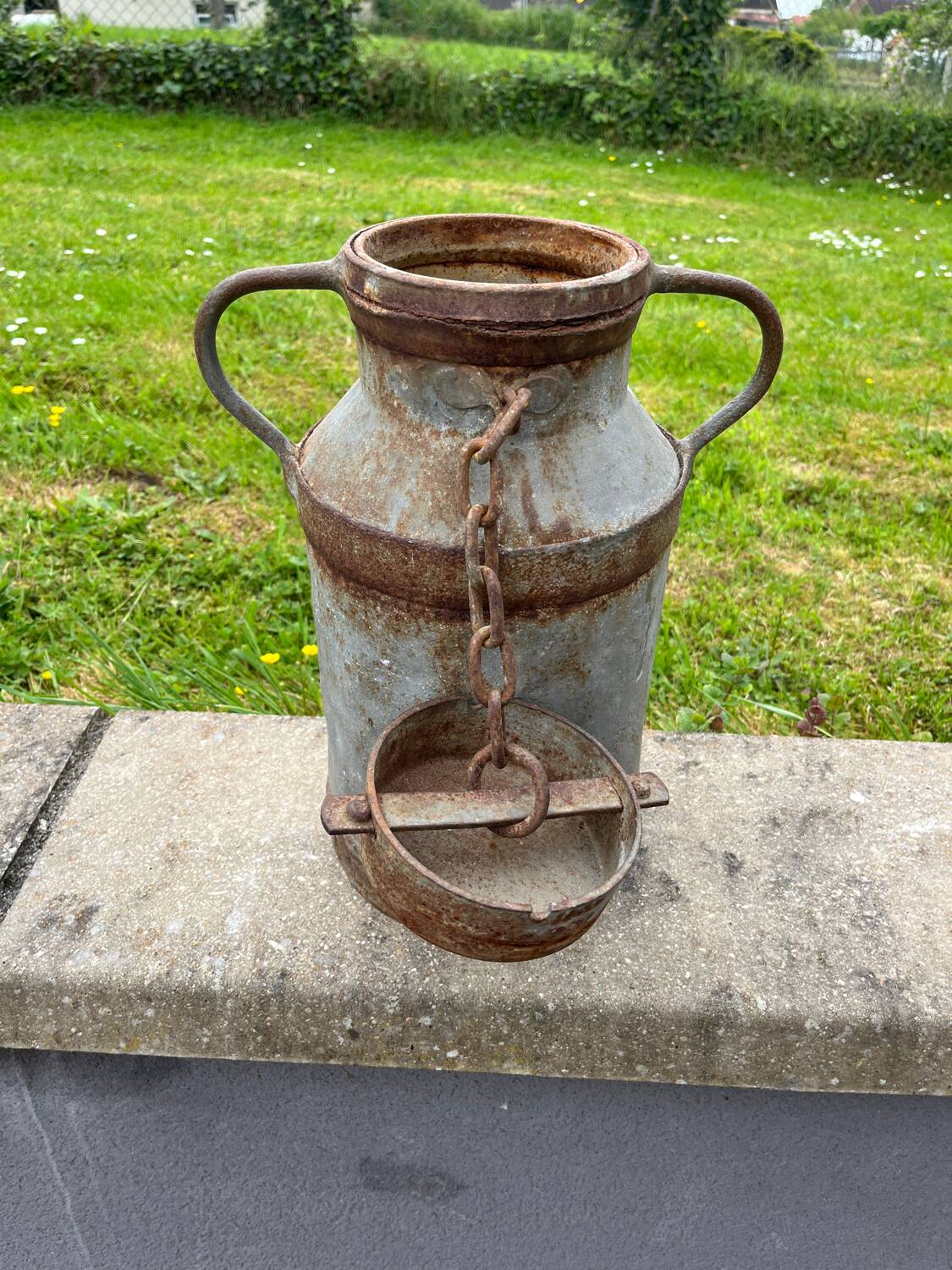 Old metal can or milk jug