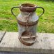 Old metal can or milk jug