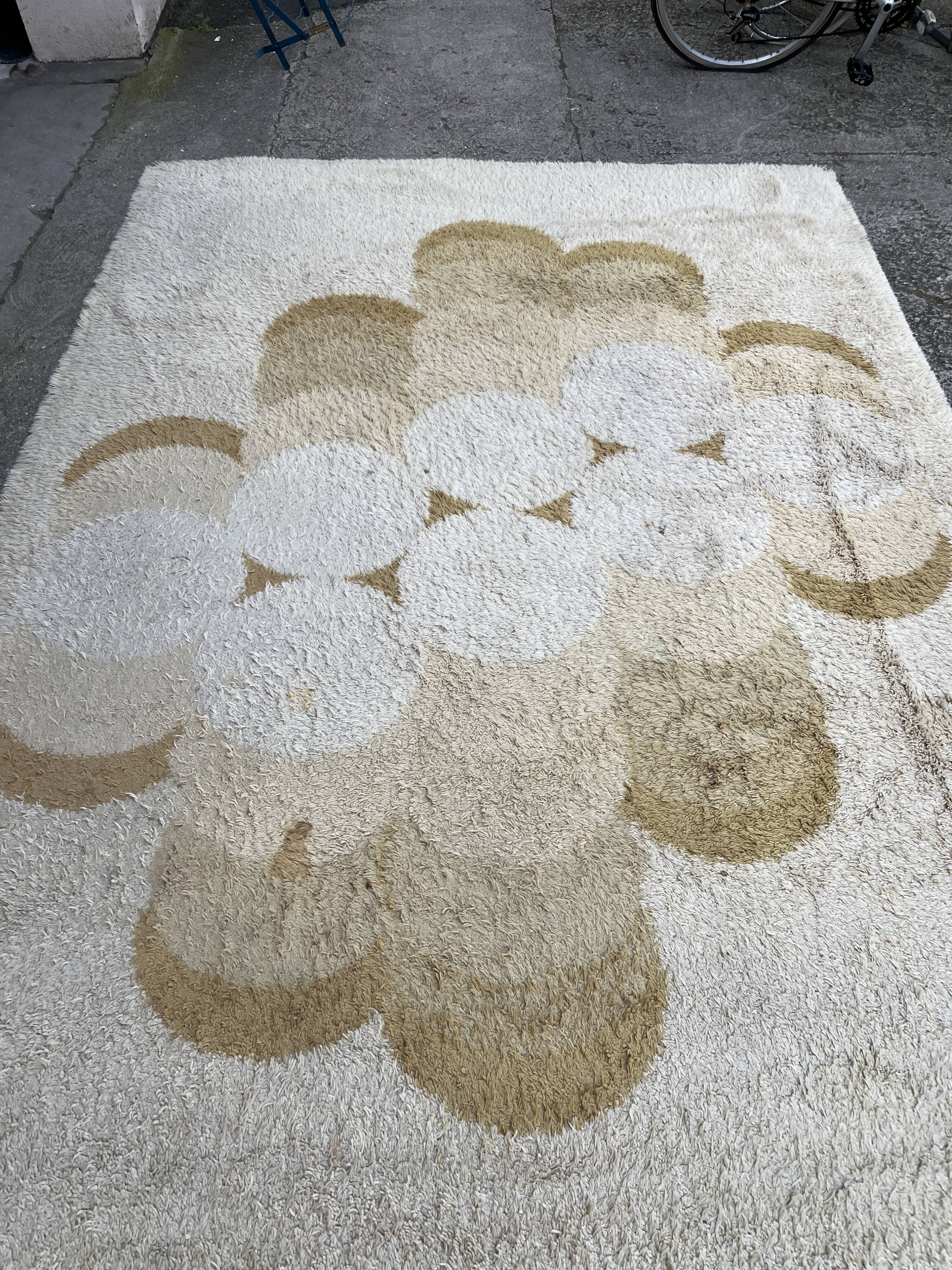 Large rug with floral decoration.