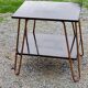 Vintage double wooden side table with copper base from the 50s