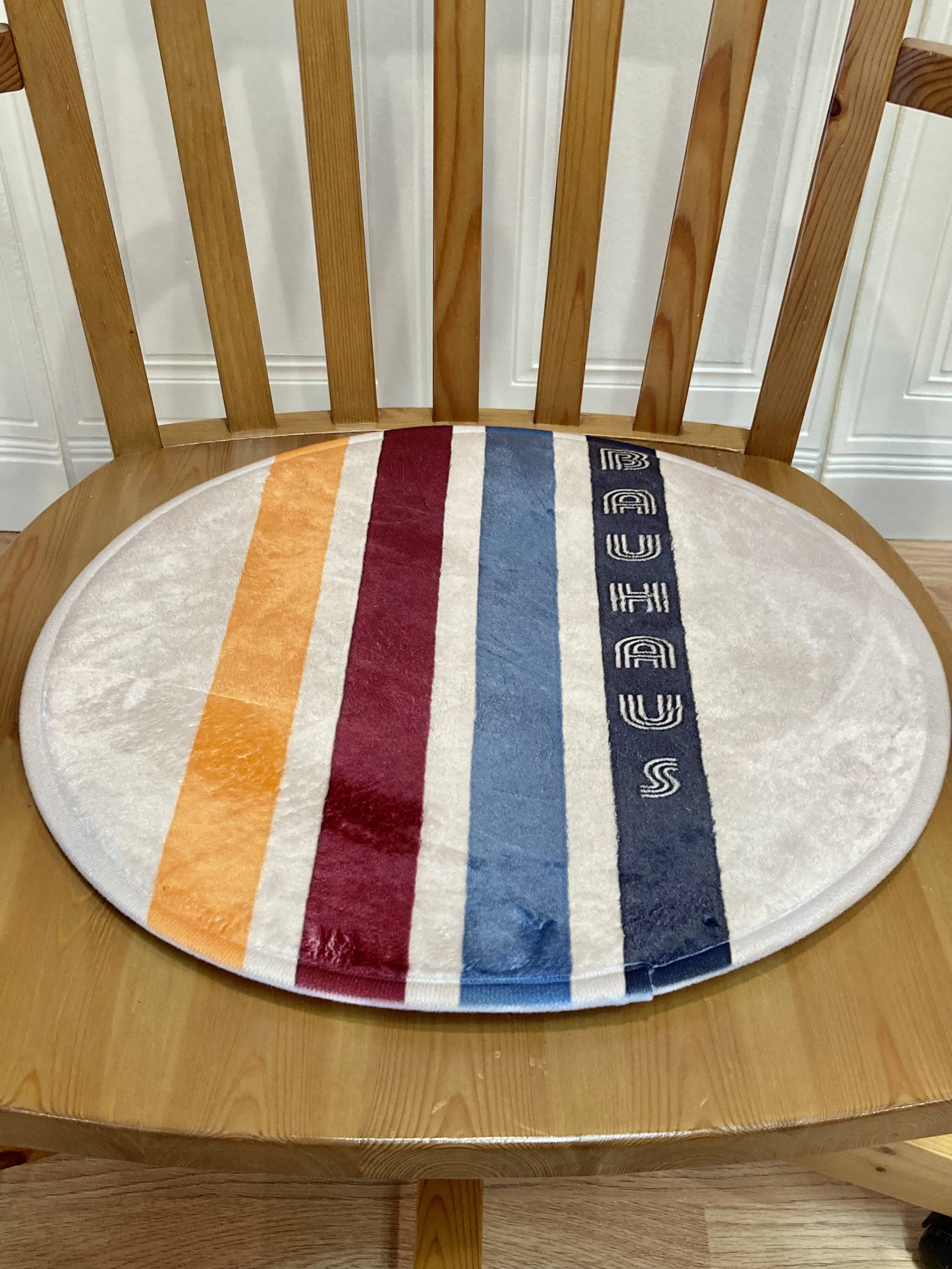 Solid wood swivel and reclining armchair.