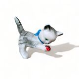 Little ceramic cat playing with a playful ladybug plays gray and white decoration