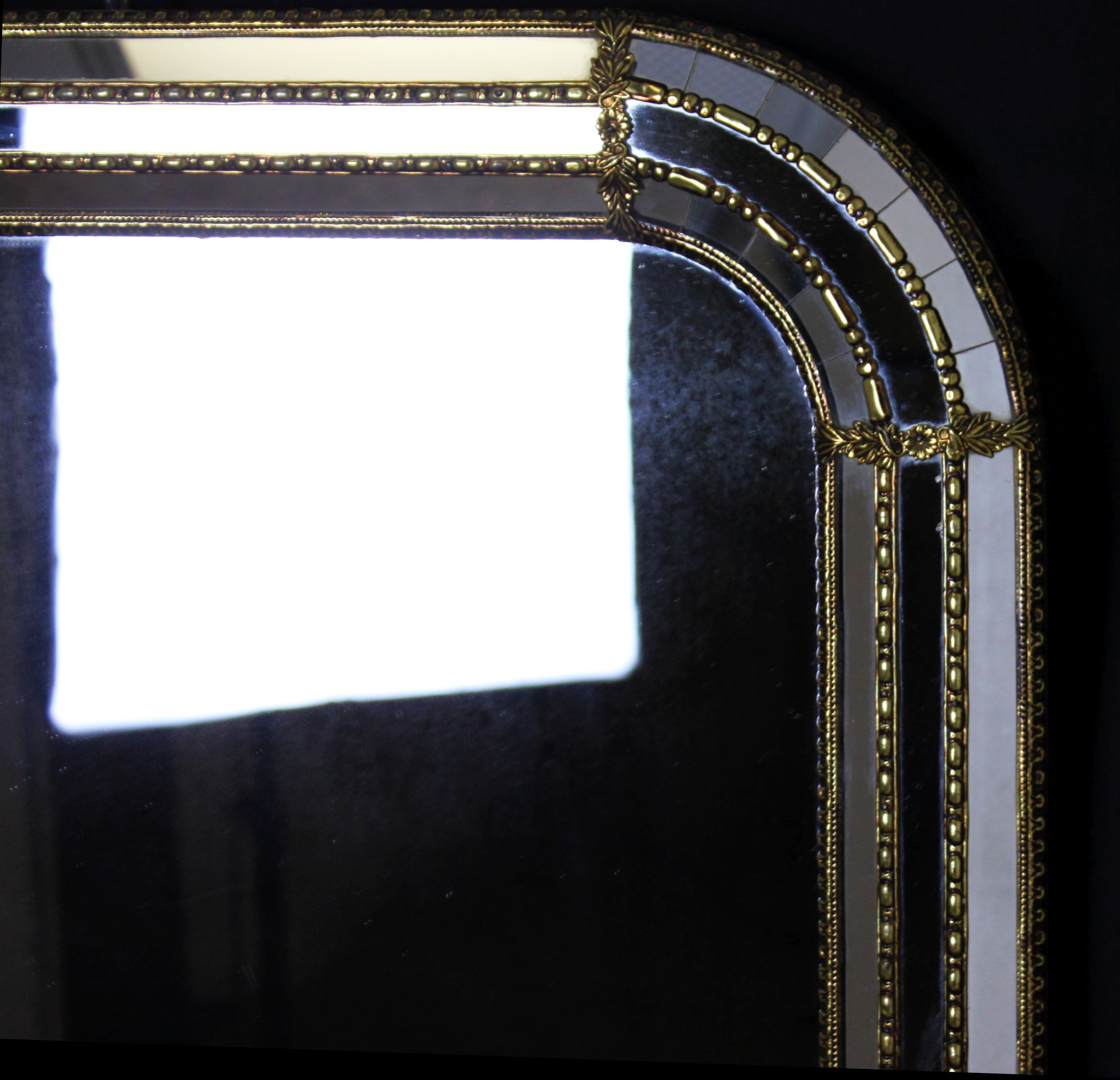 Faceted mirror and gold brass pare closes