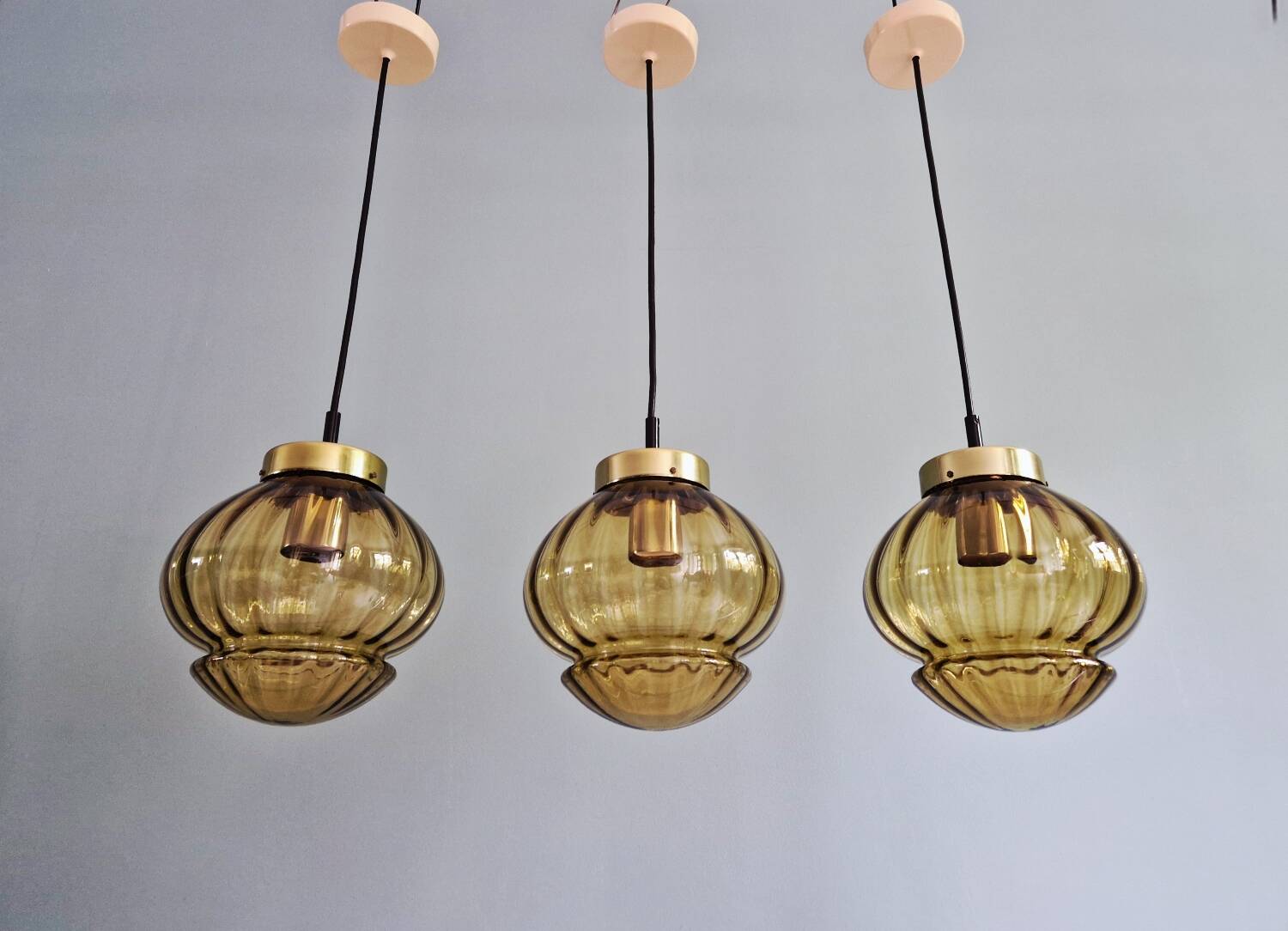 Set of 3 amber glass pendant lights, RAAK Amsterdam, 1970
