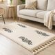 Tapis berbère écru à motifs ondulés noirs