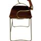 Contemporary sculptural bar stool with a metal back in aged brass and cognac leather.