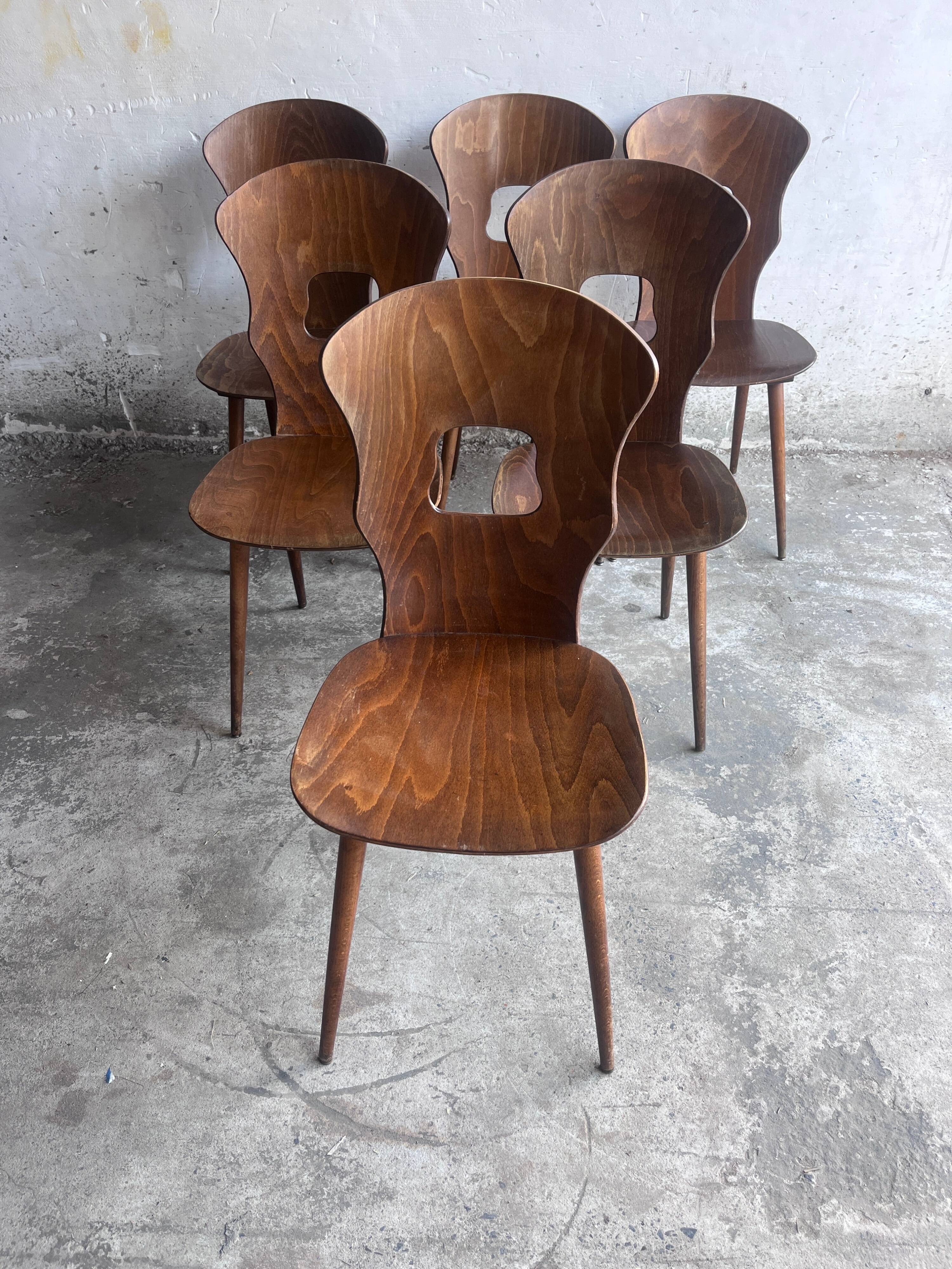 Set of six plywood dining chairs by Baumann, France, 1950s.