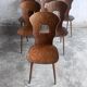 Set of six plywood dining chairs by Baumann, France, 1950s.