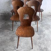 Set of six plywood dining chairs by Baumann, France, 1950s.