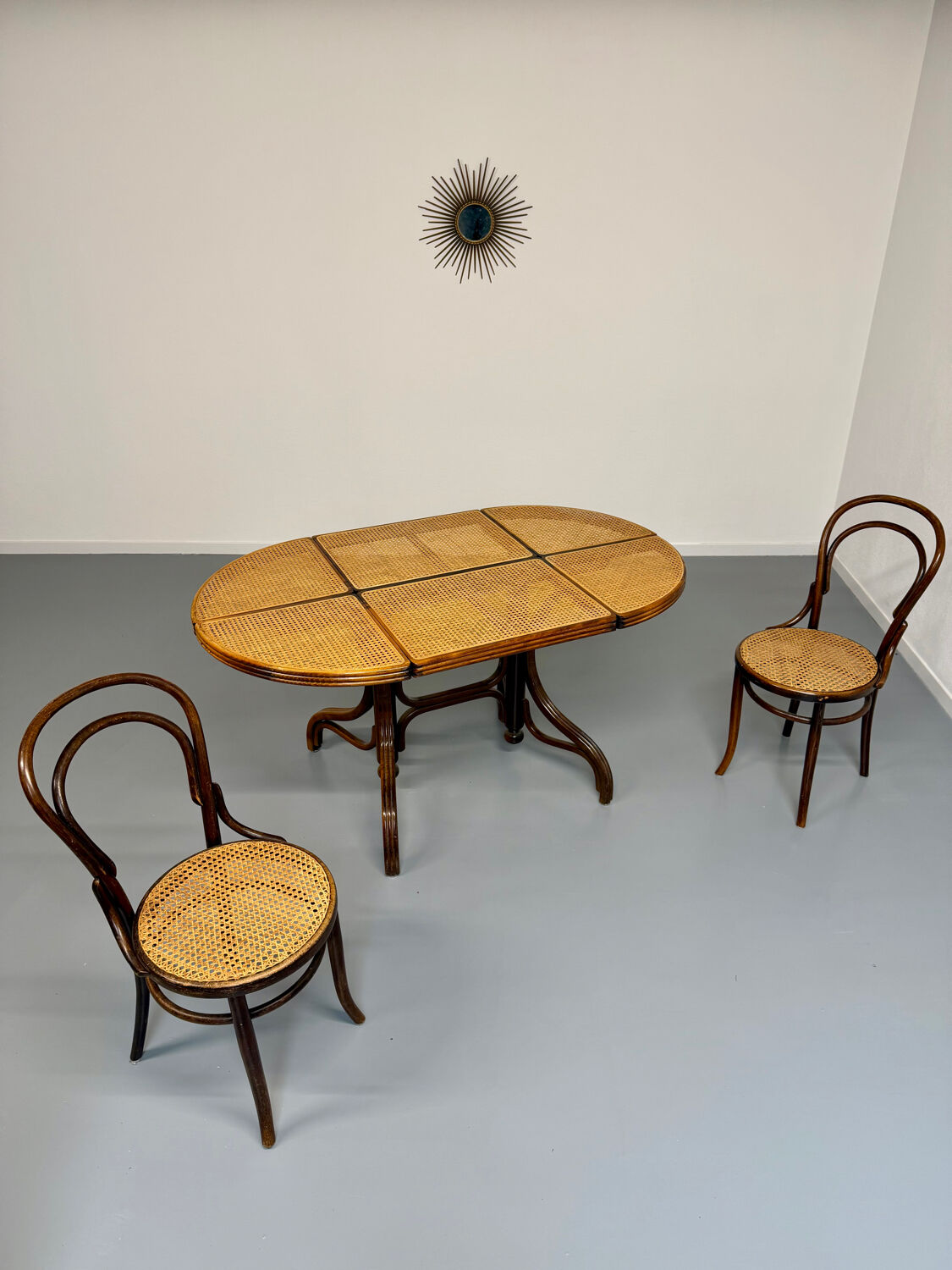 Vintage dining table with a cane top by Mundus from the 1970s.
