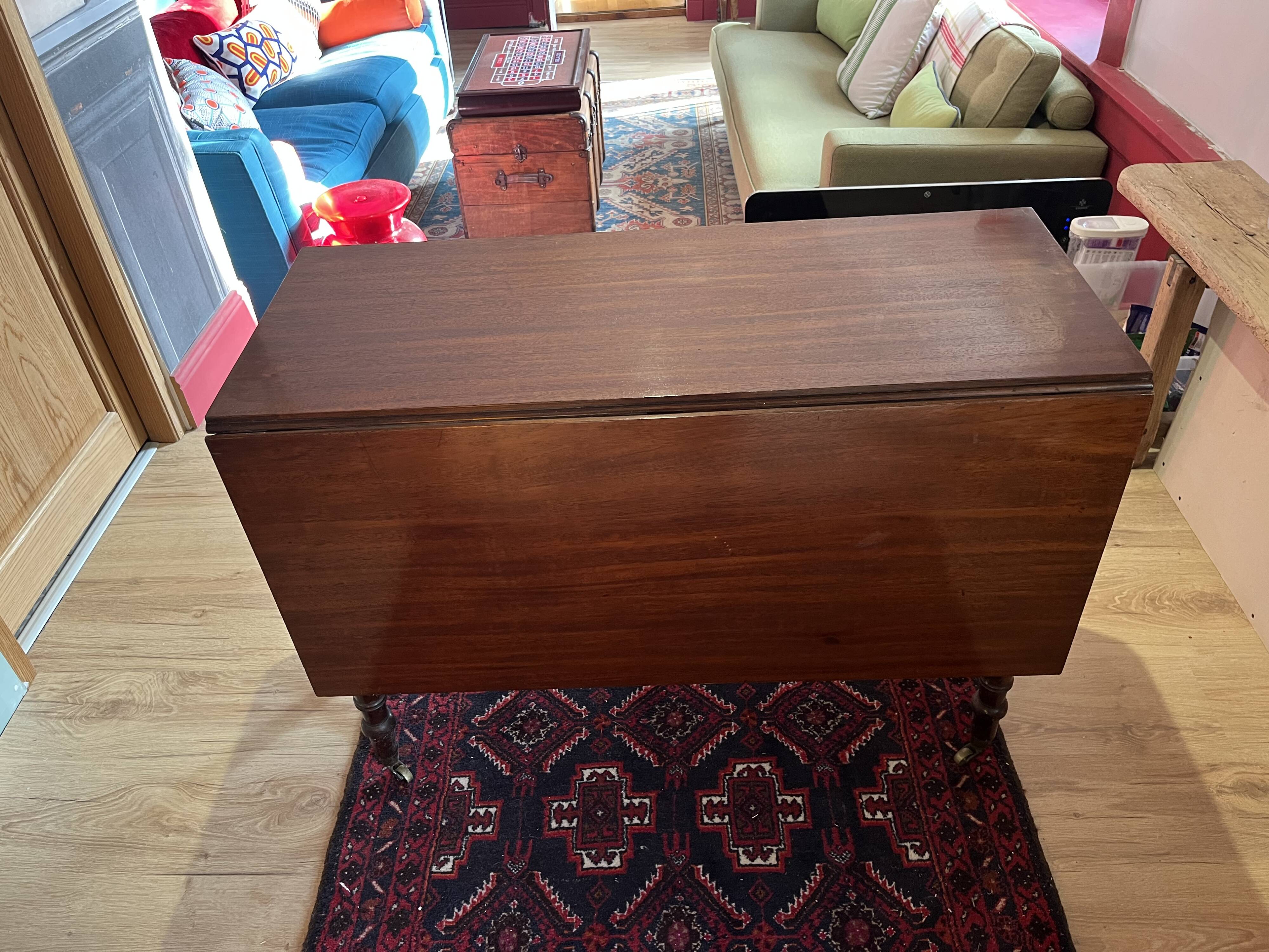 Vintage drop-leaf mahogany table; ideal for decorators.