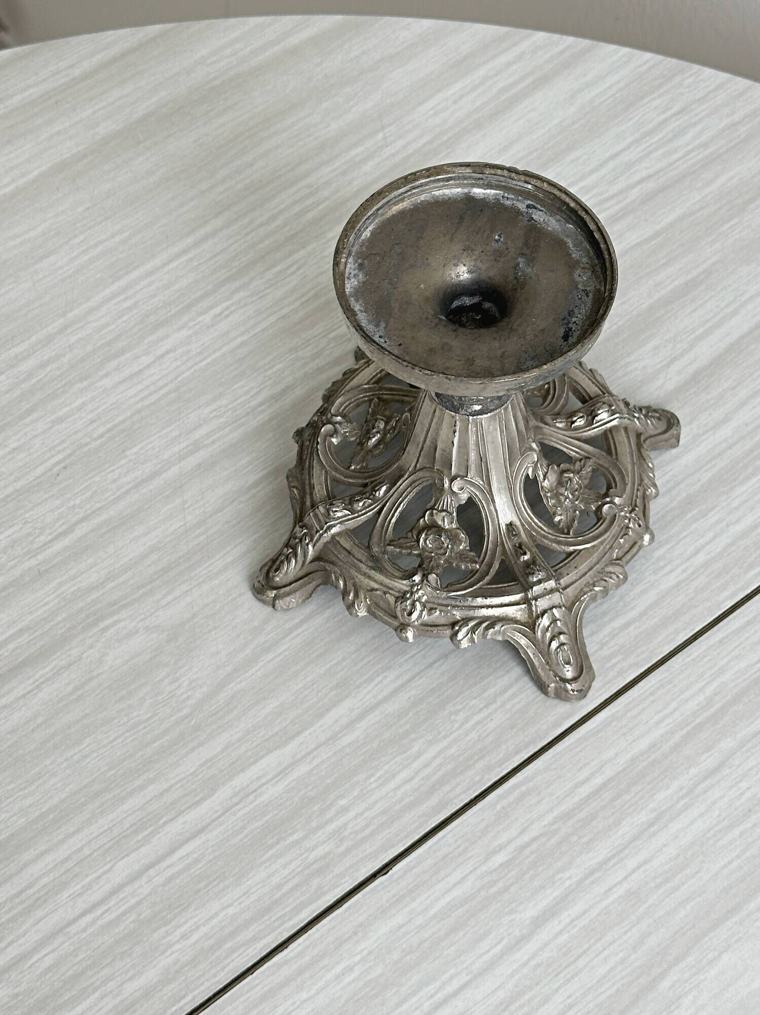 Candle holder with sculpted metal base, antique.
