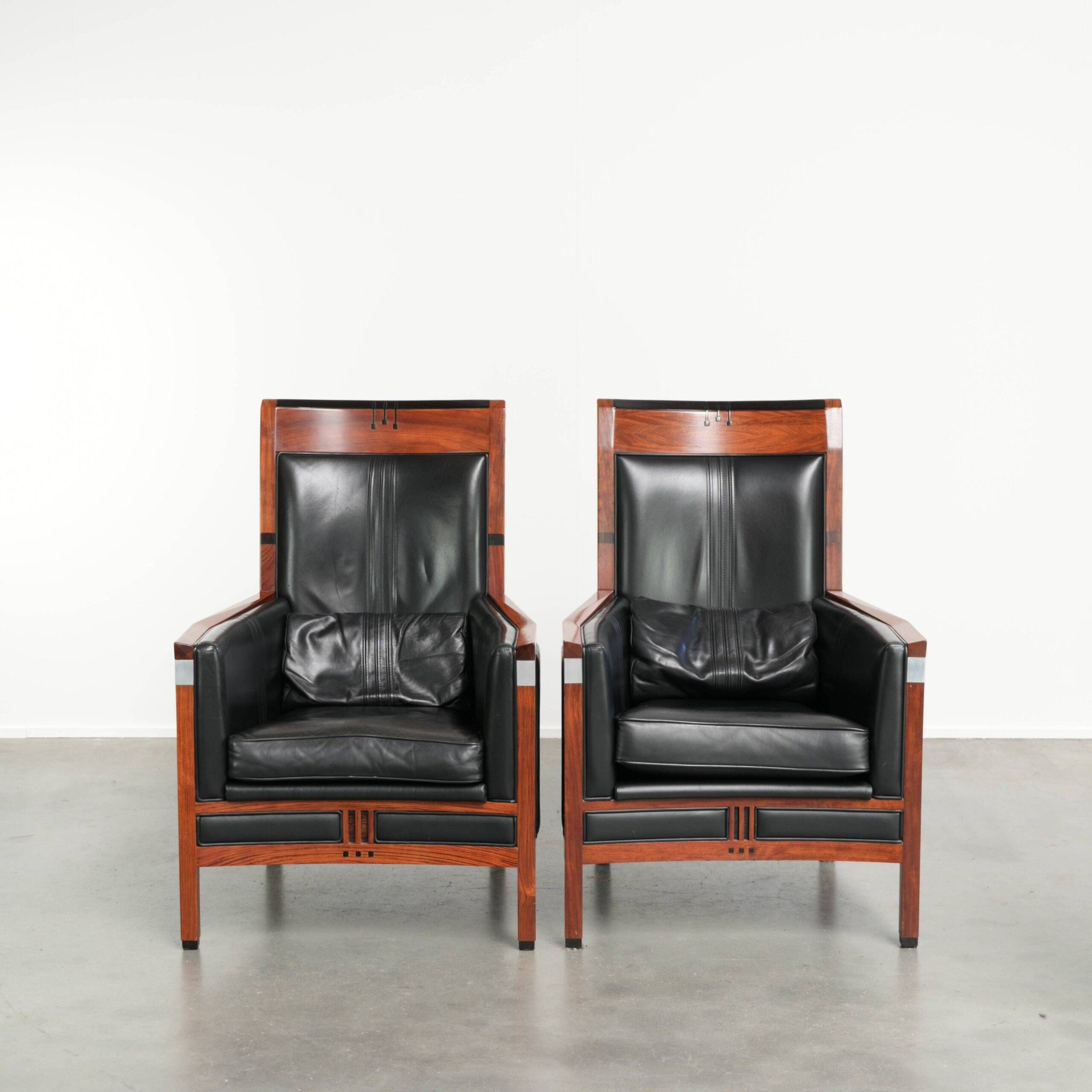 Set of 2 Art Deco design armchairs in black cowhide leather