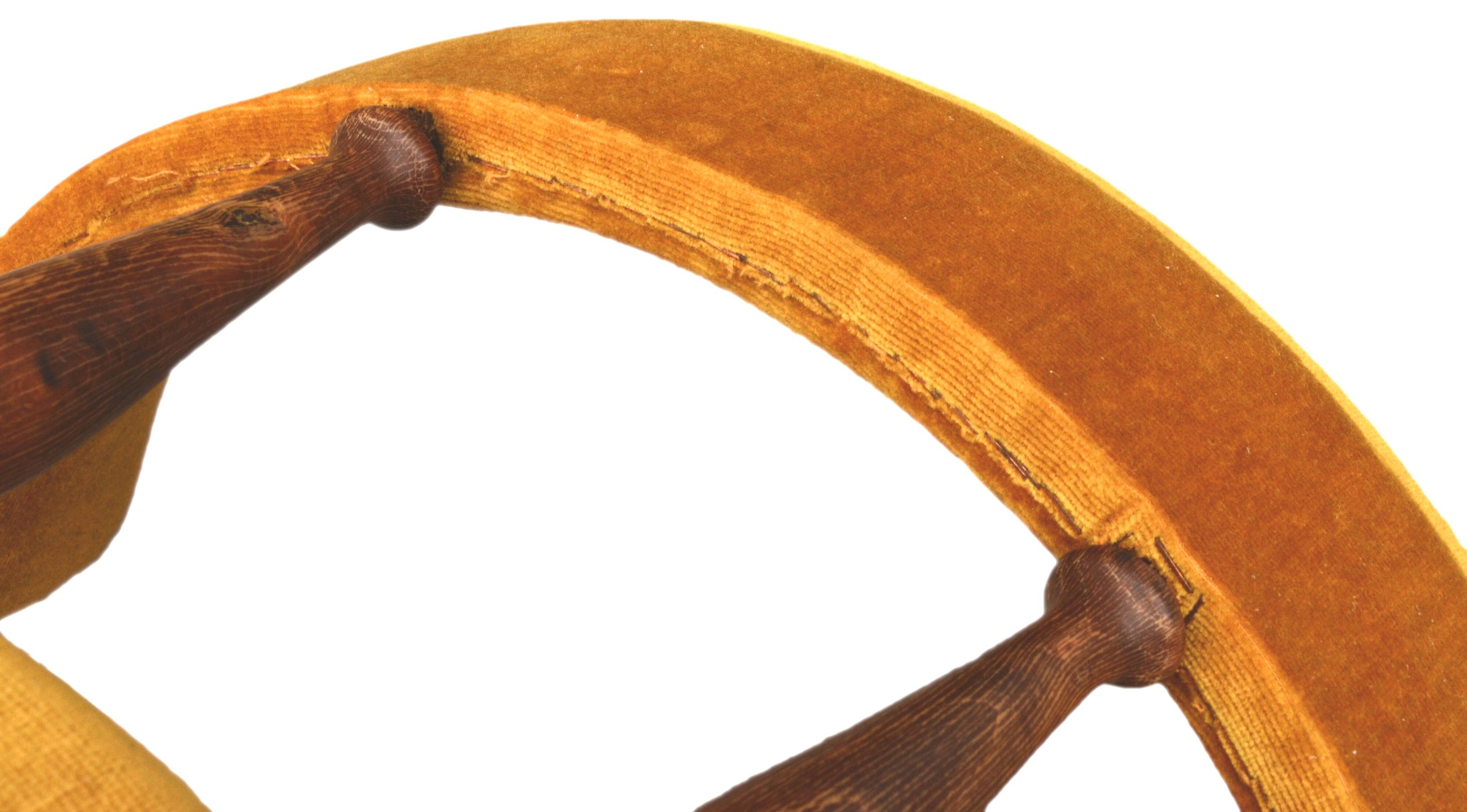 Mustard gondola armchair in the style of Helmut.