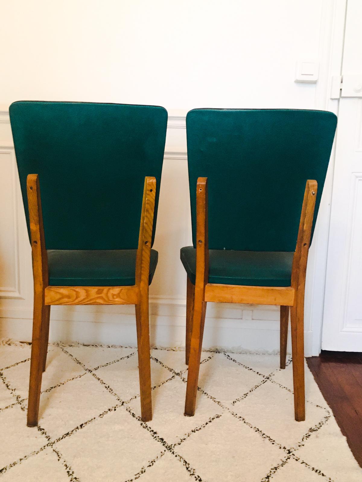 Two 1950s chairs made of wood and skai