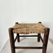 Small rustic vintage wooden and straw stool -