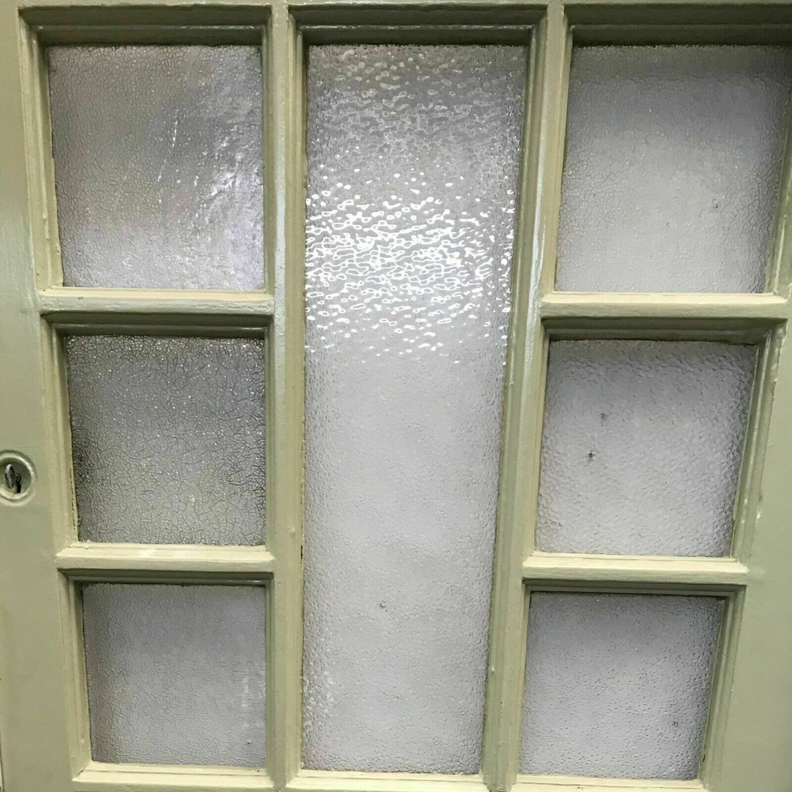 Porte de service à petits carreaux et imposte vitrée XX siècle