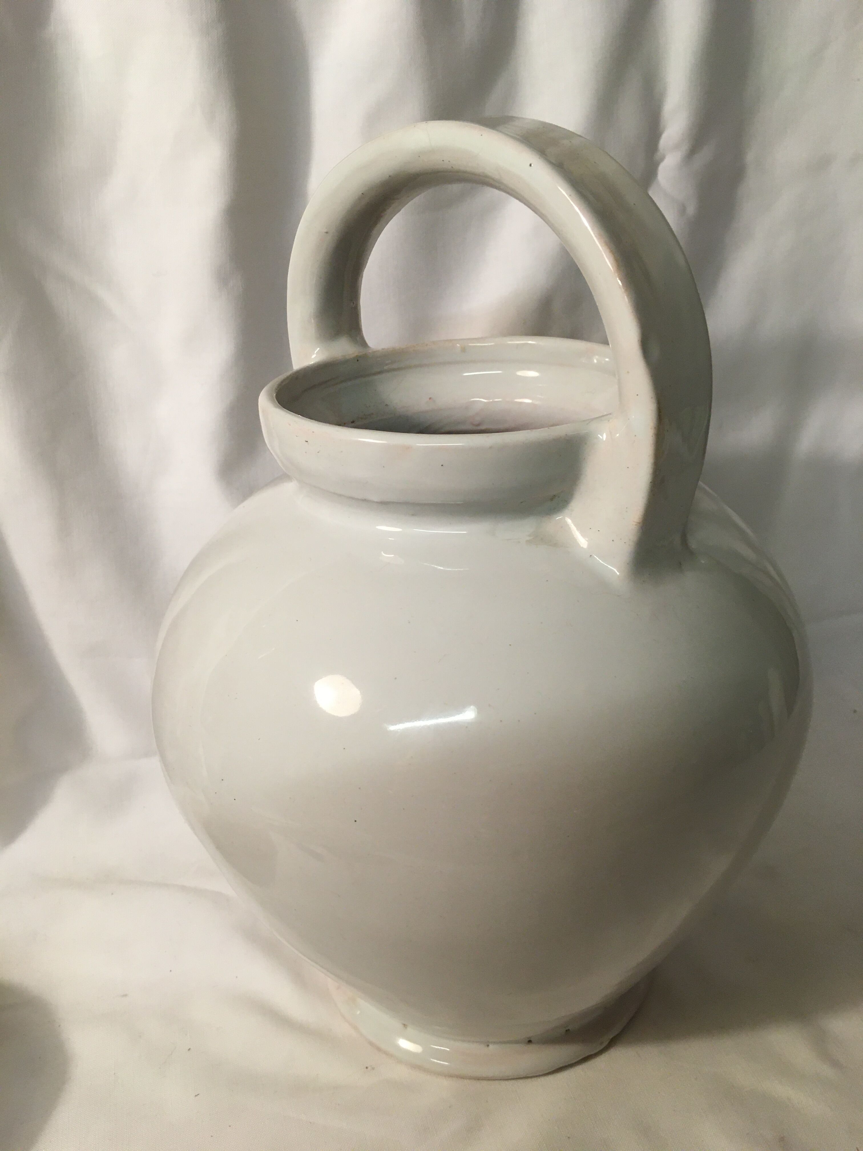 Old chevrette / pitcher in white earthenware