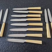 Philos - Set of 12 stainless steel dessert knives with bakelite handles.