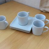 4 coffee cups and saucers
