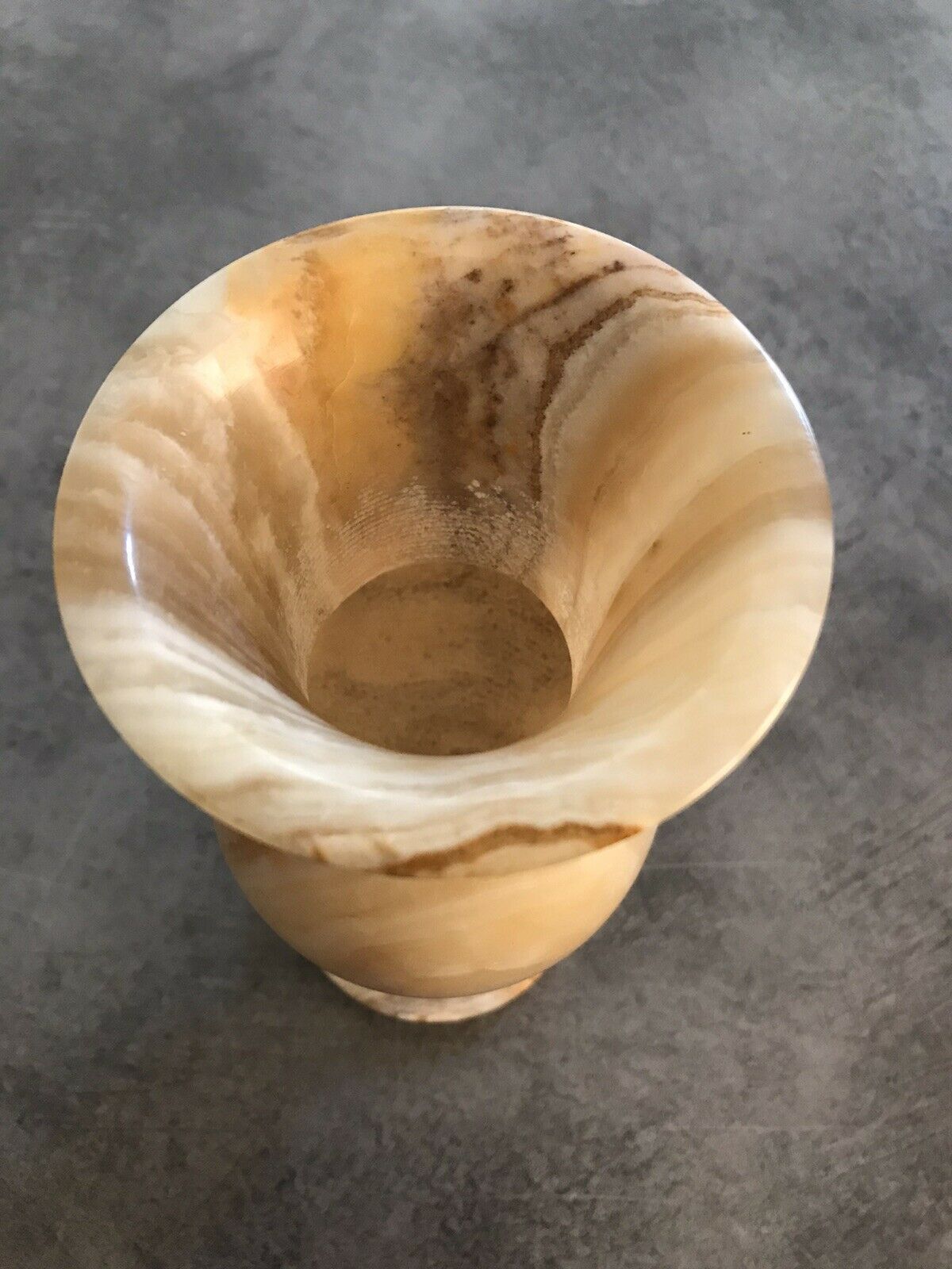 Vintage vase in marbled onyx stone shades of beige and brown