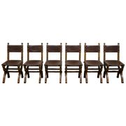 Set of six Renaissance-style chairs in oak and leather.
