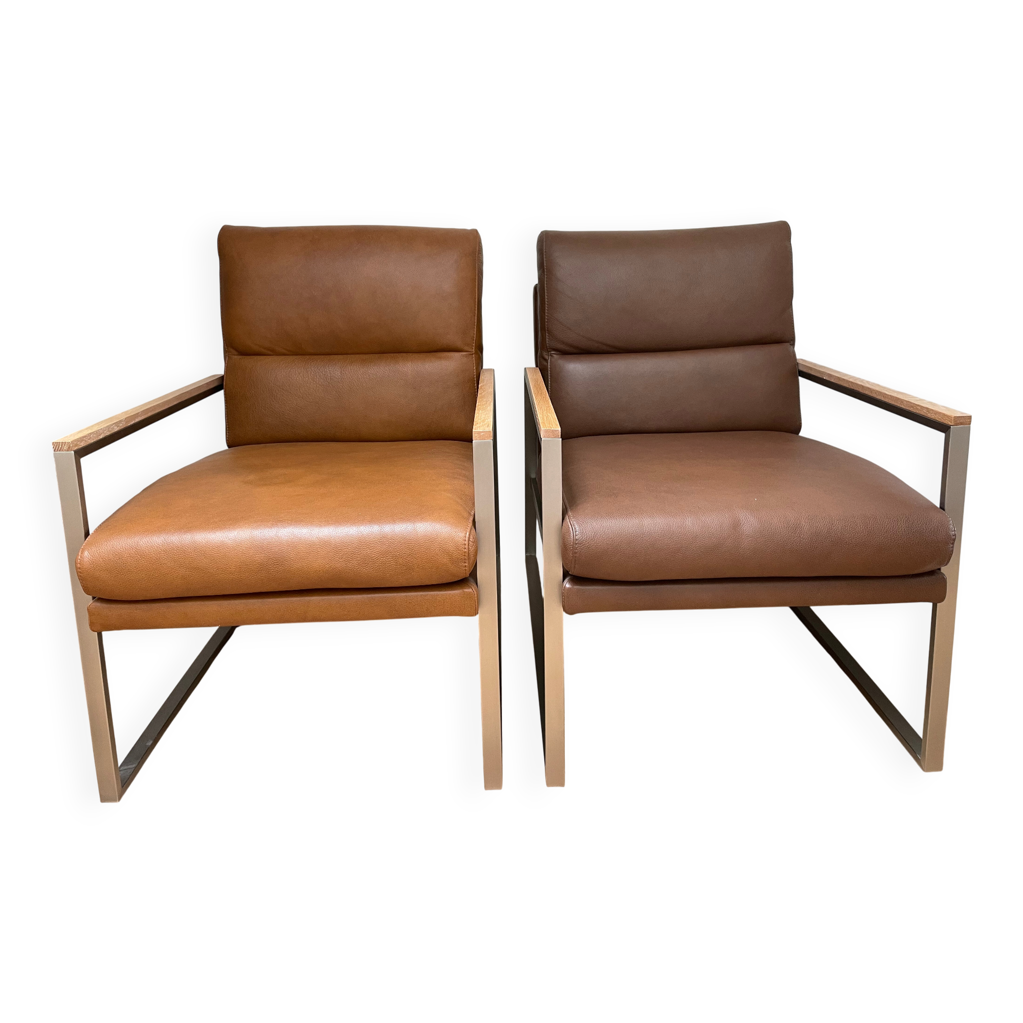 A pair genuine leather armchairs.