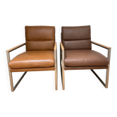 A pair genuine leather armchairs.