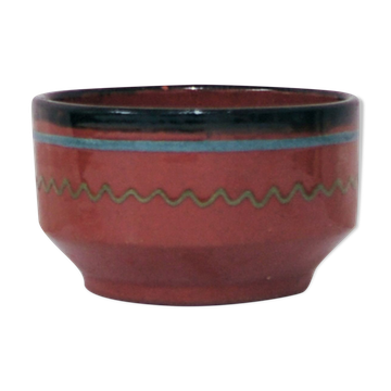 Brown bowl with a green and blue design