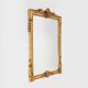 Highly decorated gilted carved wooden wall mirror, Belgium ca. 1950