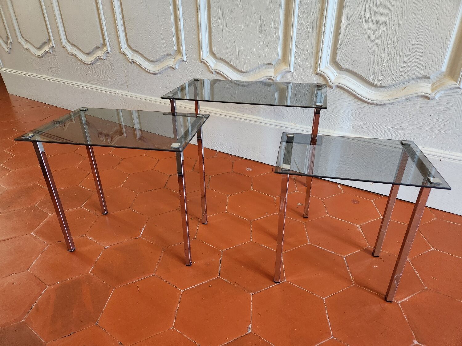3 nesting tables from the 1970s in smoked glass.