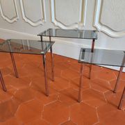 3 nesting tables from the 1970s in smoked glass.