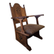 Antique Gothic Revival carved oak armchair, 1910