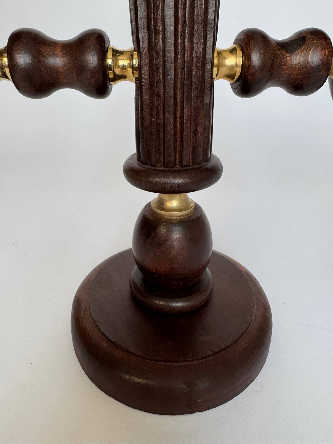 Vintage brutalist wooden candelabrum with gold hardware.