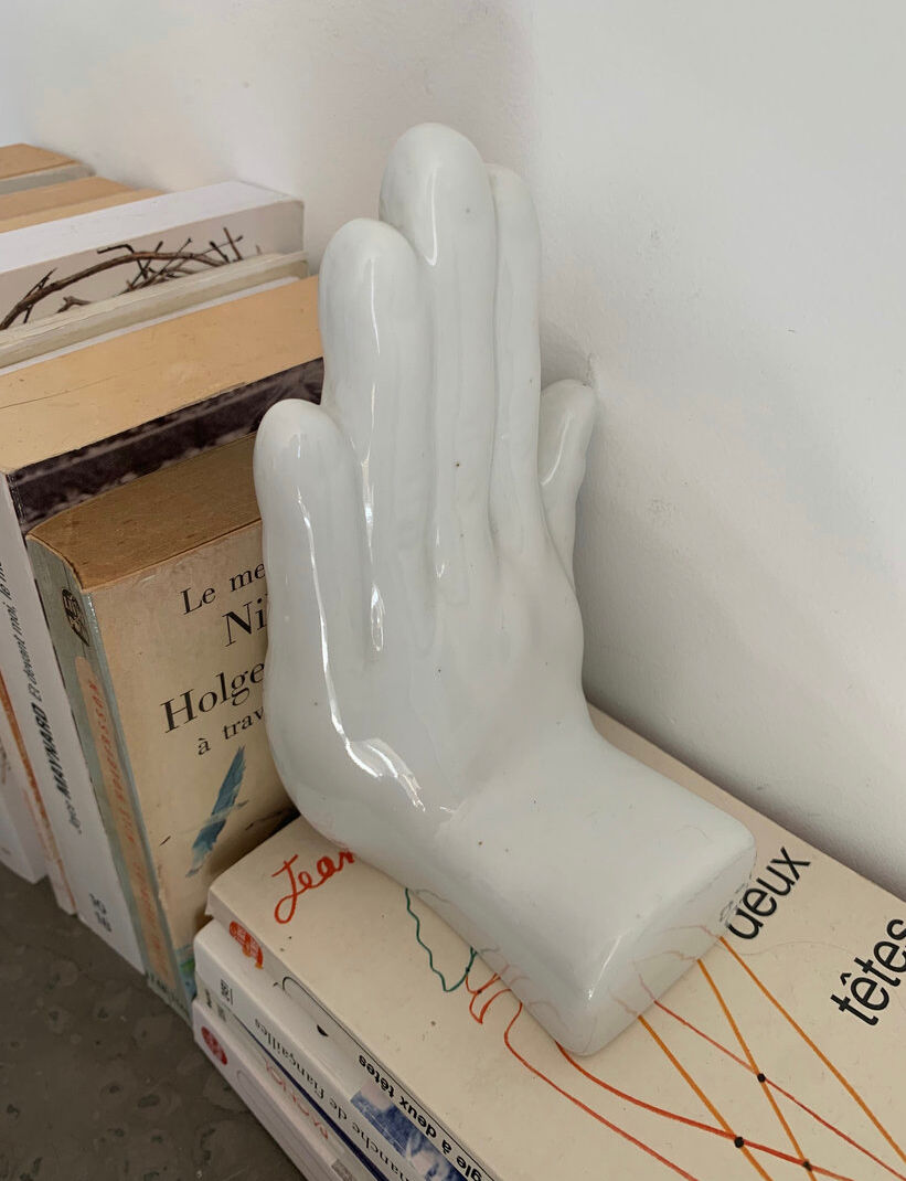 Vintage bookends in the shape of ceramic hands