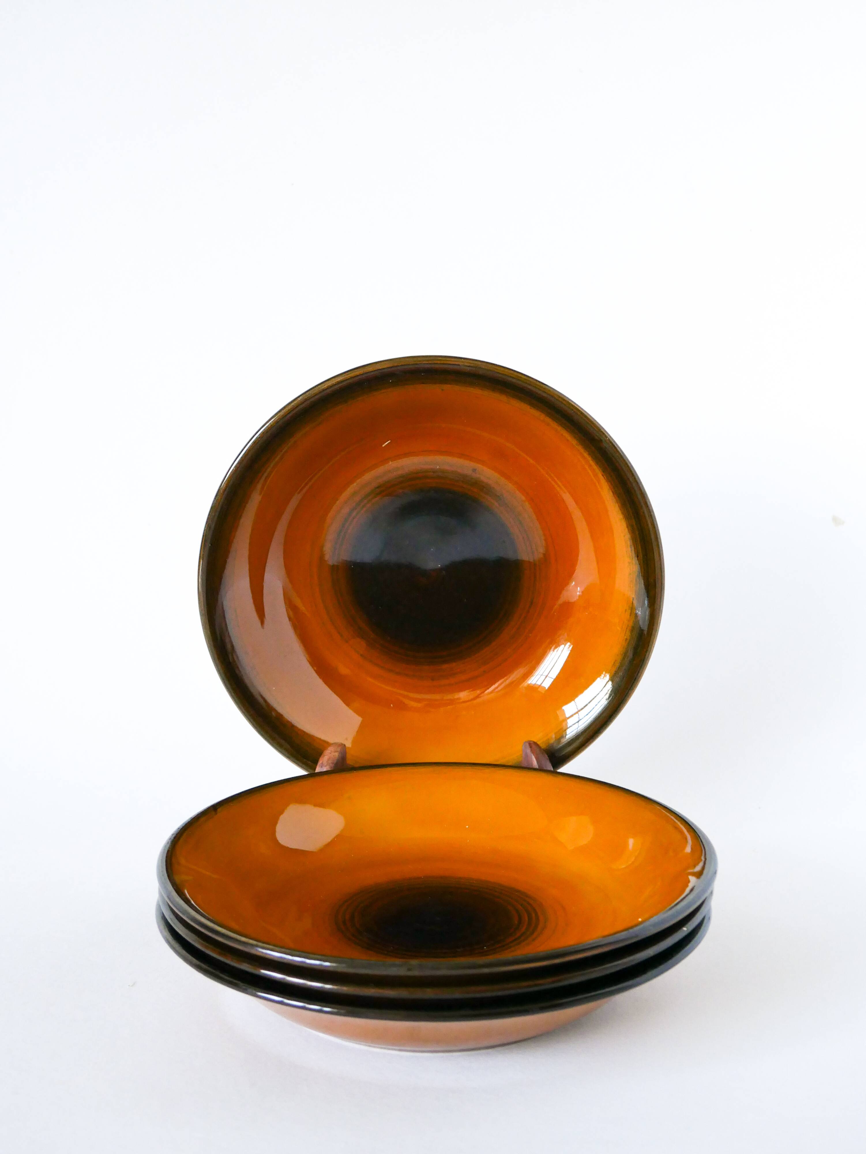 Set of 4 glazed ceramic deep plates, Longchamp, 1960