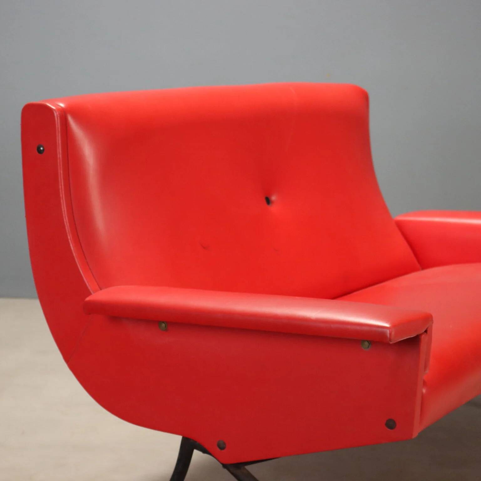 Vintage red faux leather sofa from the 1960s.