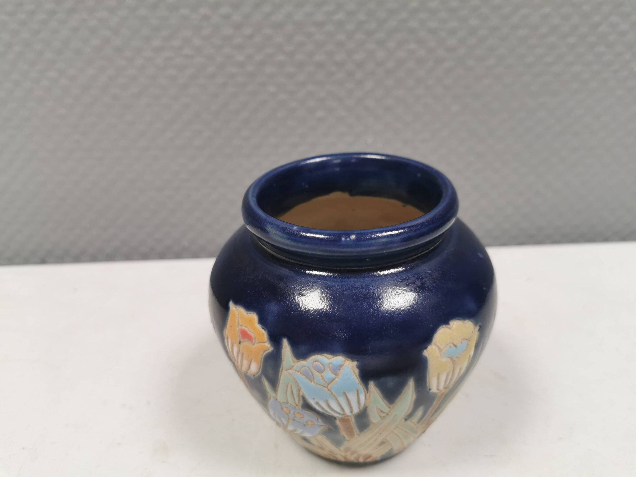 Small delicious blue ceramic vase with floral decoration. Sweden 1970s
