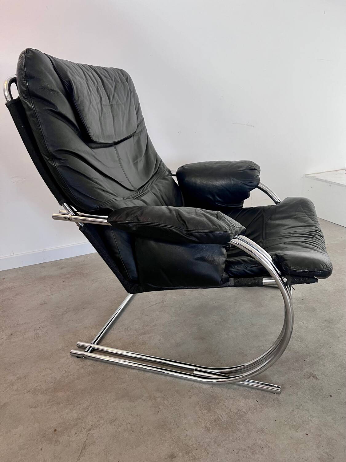 Old armchair and ottoman black leather tubular chrome bauhaus design from the 70s