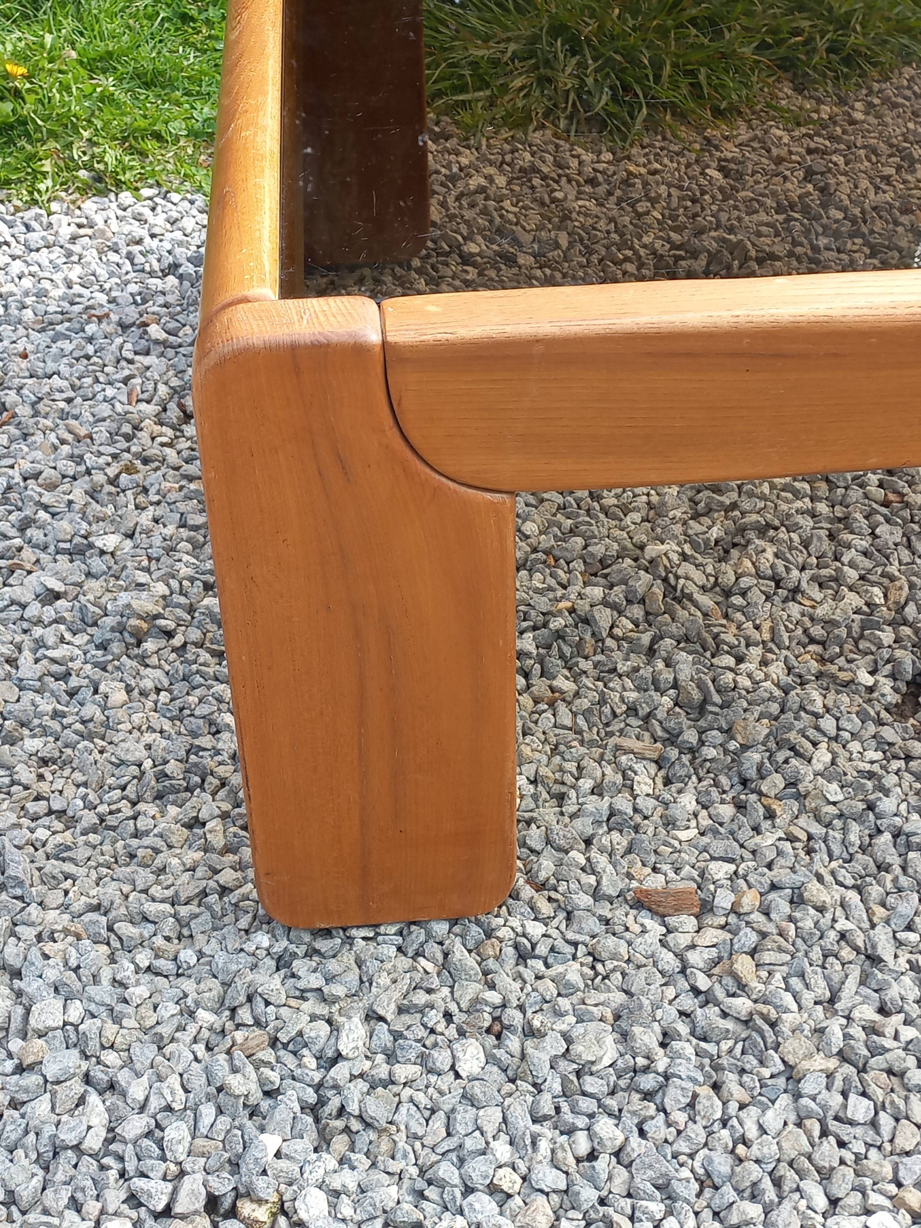 Coffee table from Regain in solid elm with a smoked glass top.